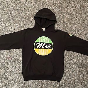 Black sweatshirt, says Moe’s and Oregon coast on the front and sleeve